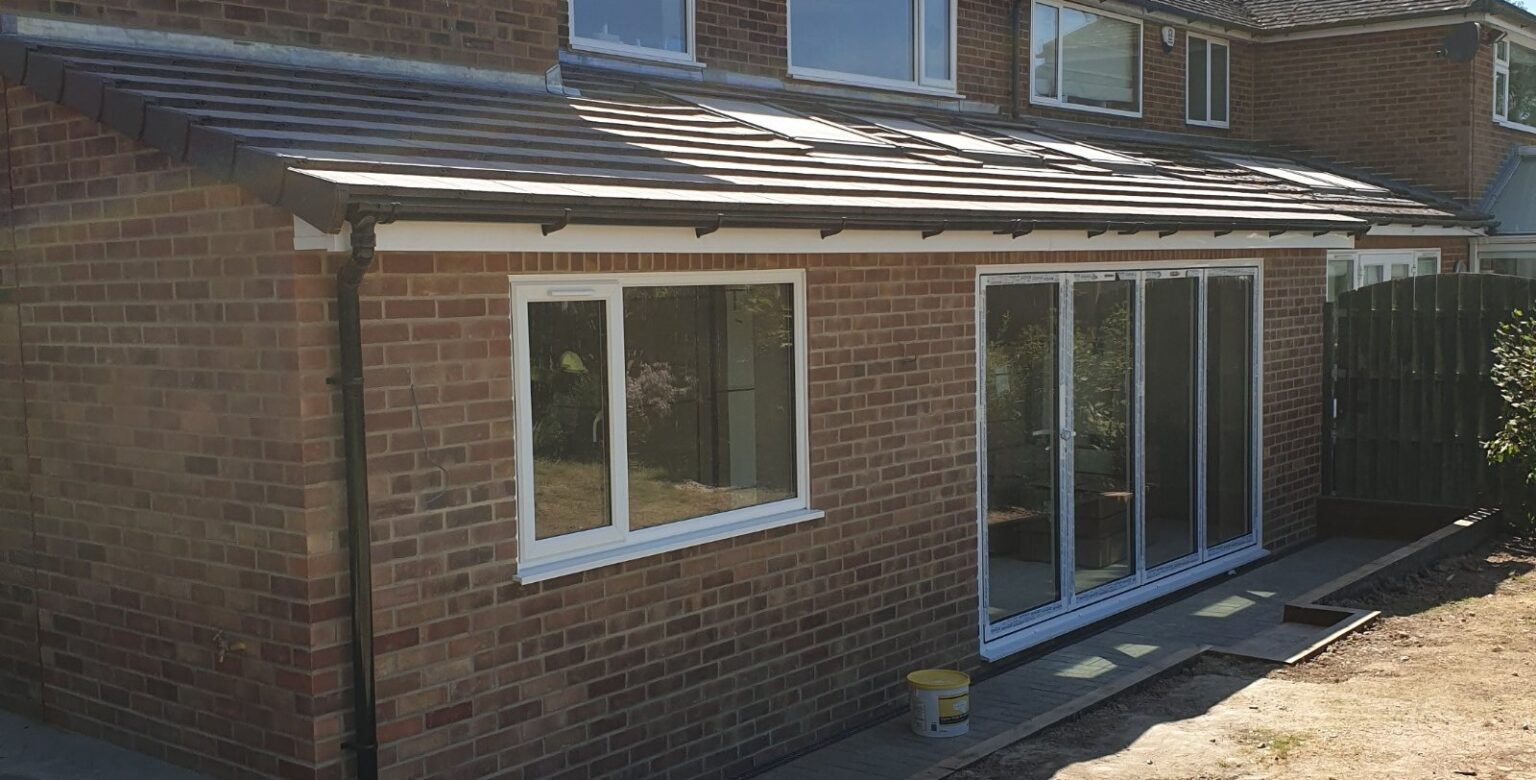 Finished single-storey rear extension with a tiled pitched roof and bi-fold doors onto the garden