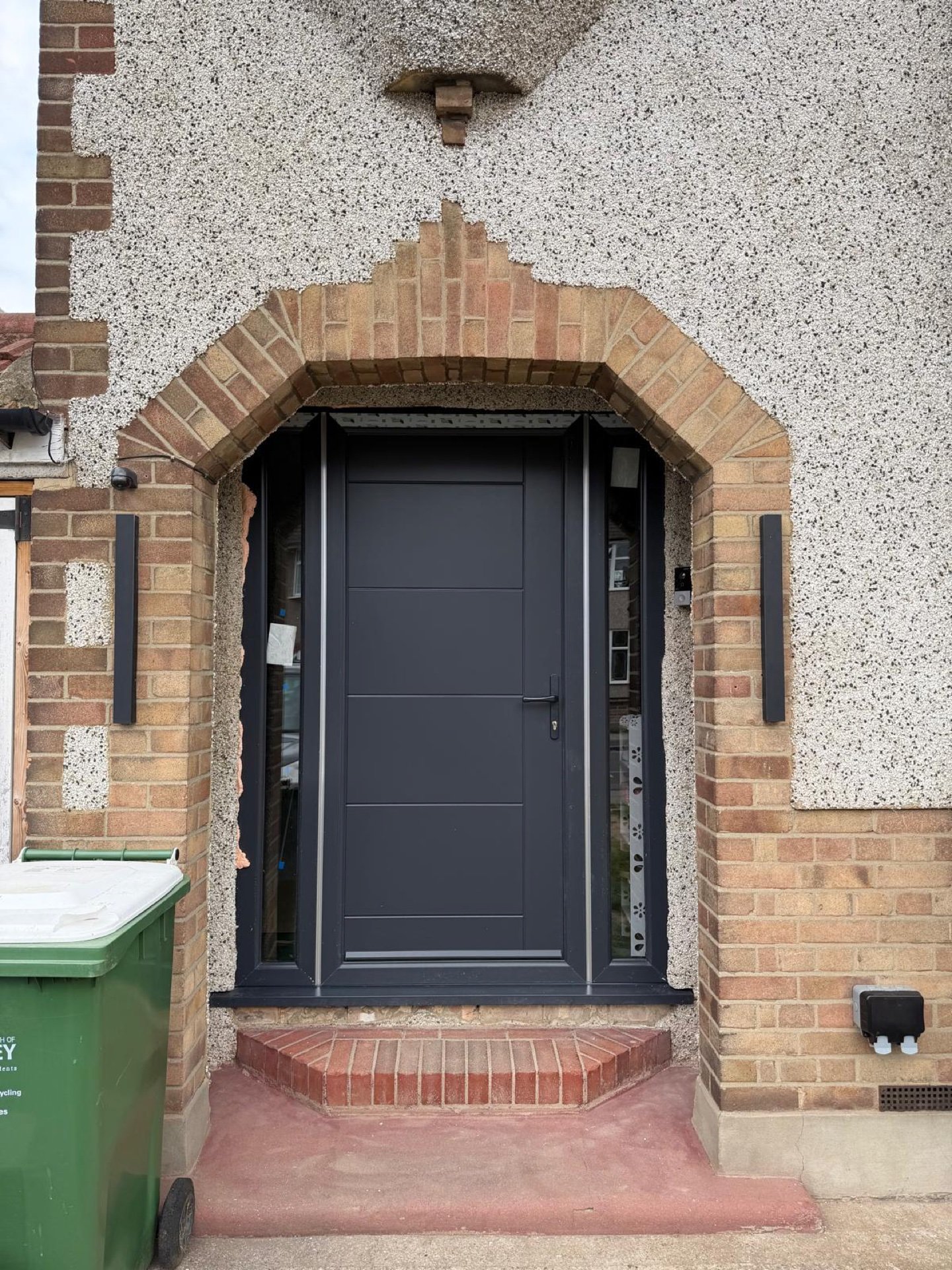 New anthracite composite front door in the original brick porch arch, Bexleyheath