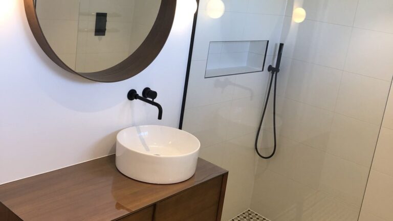 Finished wet room in a Victorian Blackheath house, round mirror, vessel basin and walk-in shower