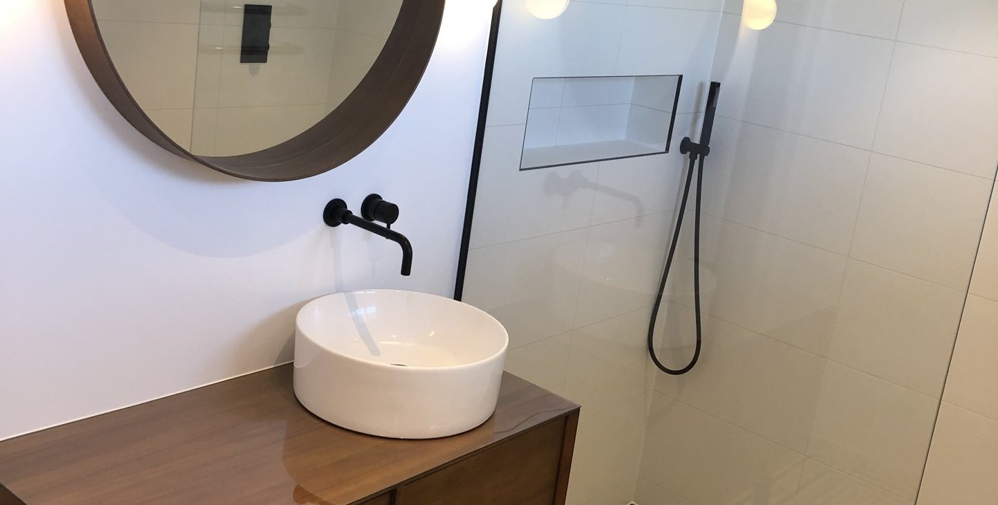 Finished wet room in a Victorian Blackheath house, round mirror, vessel basin and walk-in shower
